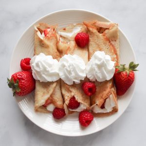 strawberry and banana on white ceramic plate